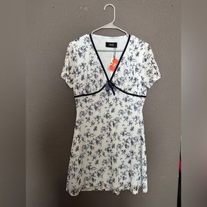 Blue Floral Mini Dress. With blue ribbon lining. Brand is Cider